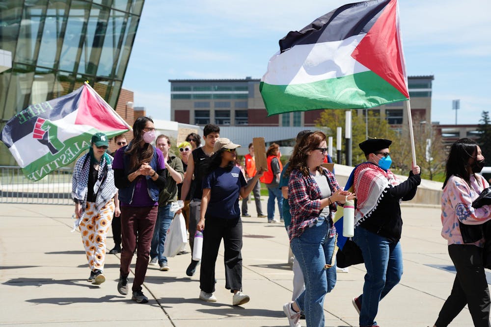 Students protest outside of the Breslin Center on April 26, 2024. They demanded that the university divest from Israel, chanting "Not another nickel, not another dime, no more money for Israel's crimes."