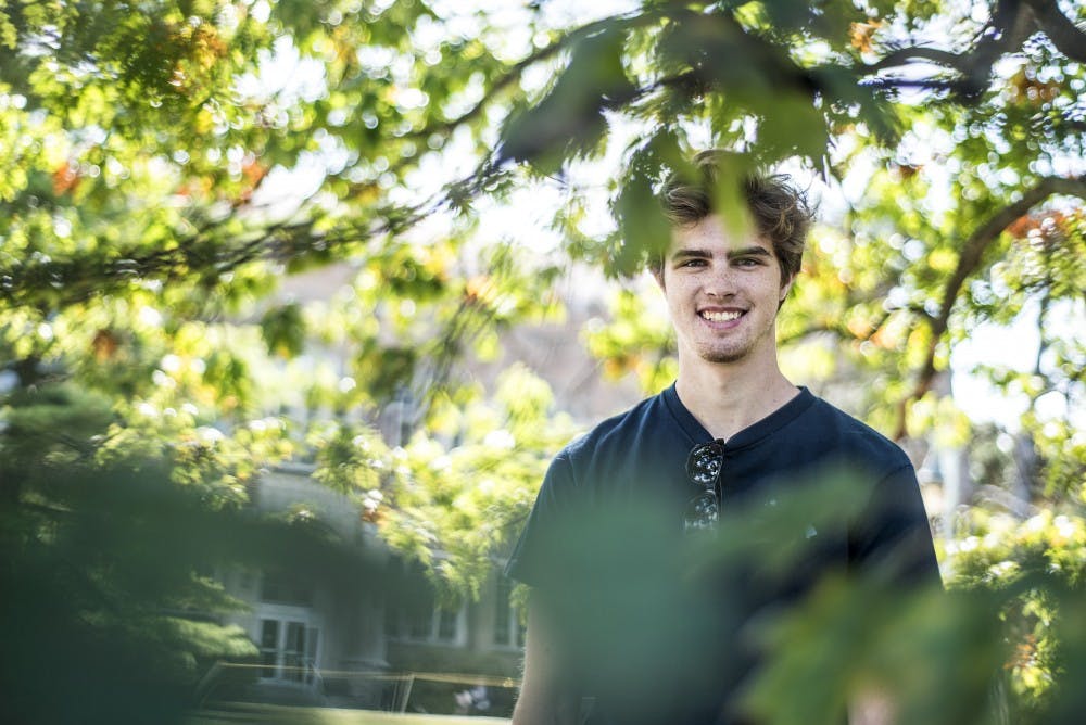 <p>Media and information senior Jacob Berney poses for a portrait after an interview regarding MSU academic ratings on Sept. 14, 2017 near the Beaumont Tower.&nbsp;</p>