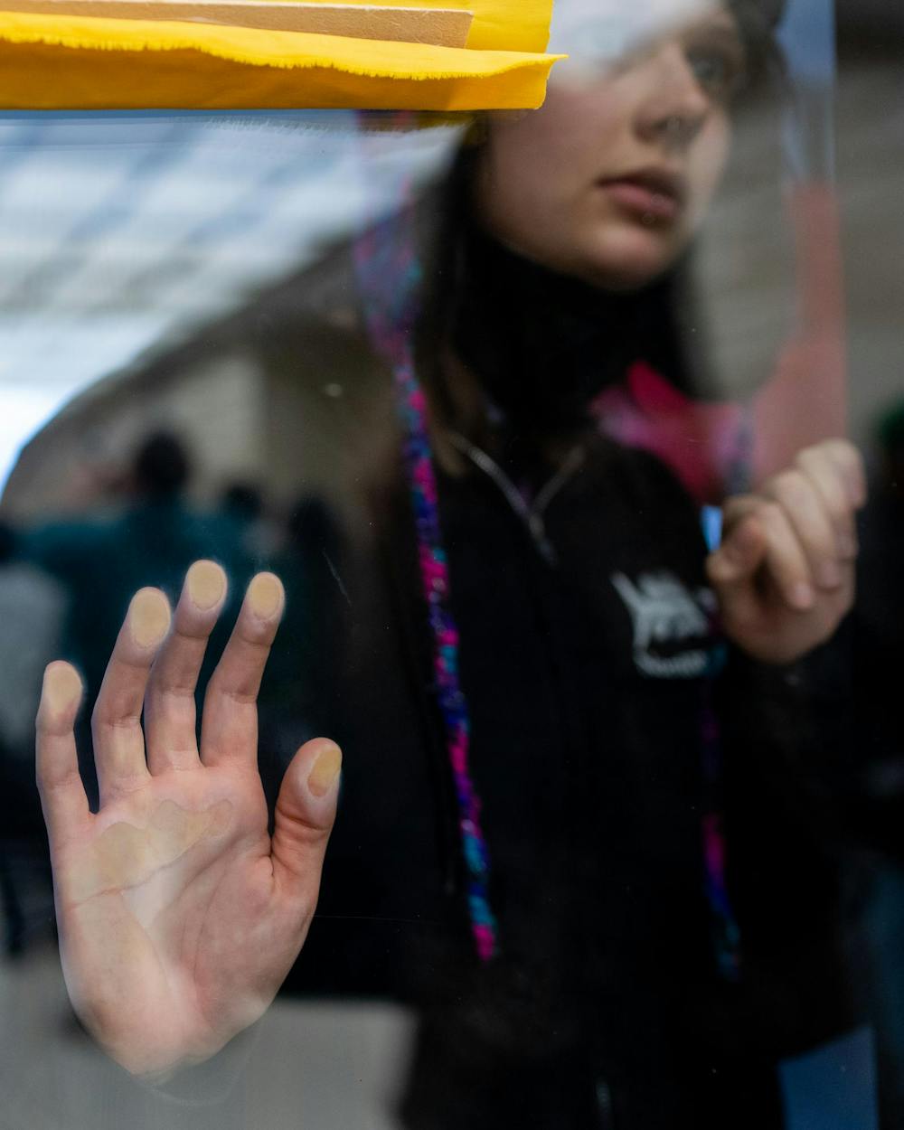 Protestors join members of the Hurryiah Coalition and Michigan State Sunrise as they protest in the lobby through the entrance doors of the Hannah Administration Building in East Lansing, Michigan on April 11, 2025. Members of MSU Sunrise and the Hurryiah Coalition protested in the lobby, 19 protestors were arrested after multiple warnings from the police. 