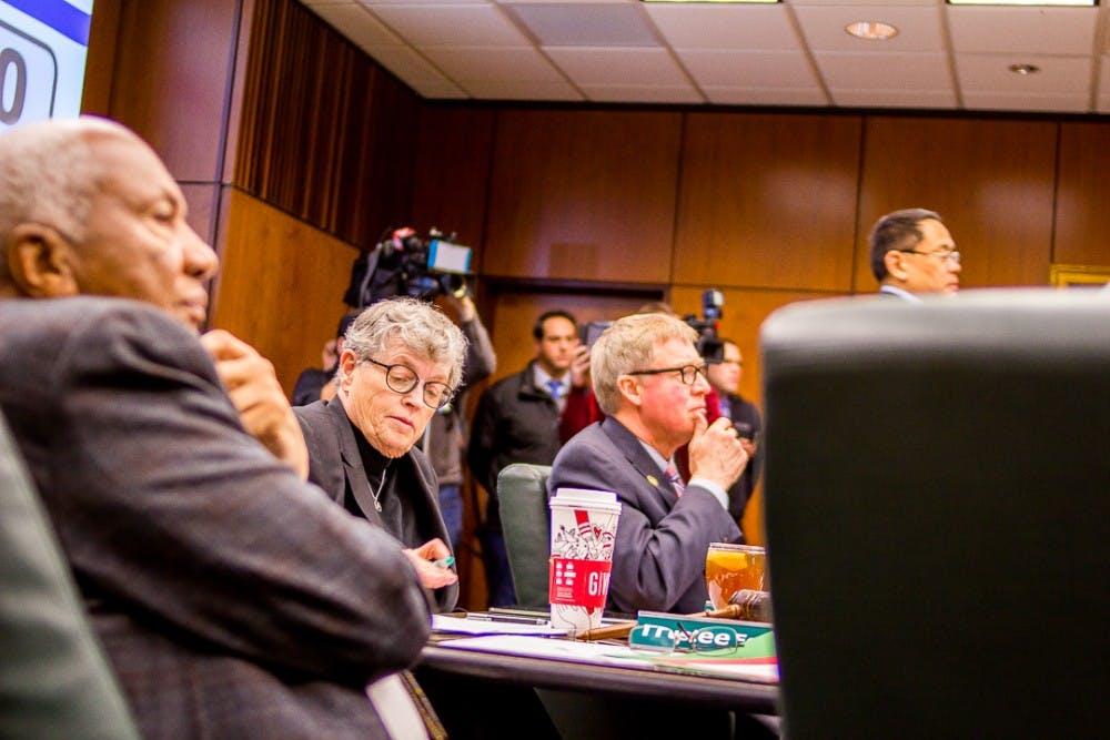 President Simon listens to victims speak during a board of trustees meeting on Dec 15, 2017 at the Hannah Administration Building. Protesters gathered to address the misconduct of MSU’s handling of the Larry Nassar investigation. 