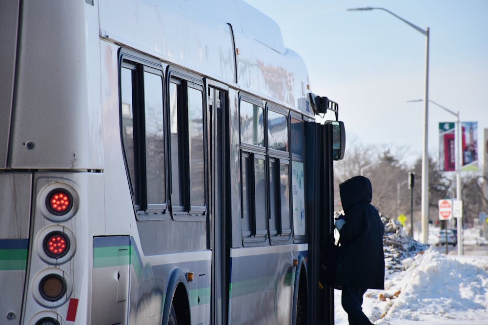 <p>An MSU student hops on a CATA bus on Jan. 24, 2022. </p>