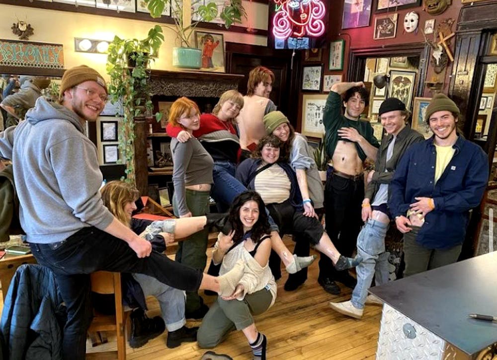 <p>Bowie co-op alumni get matching tattoos. Photo courtesy of Maeve Denshaw.</p>