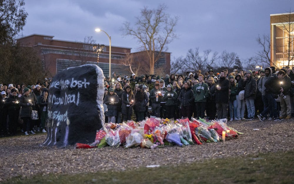 <p>Thousands gathered at the Rock on Farm Lane on Wednesday, Feb. 15, 2023, to remember Brian Fraser, Alexandria Verner and Arielle Anderson, the three victims of Michigan State University’s mass shooting on Feb. 13.</p>
