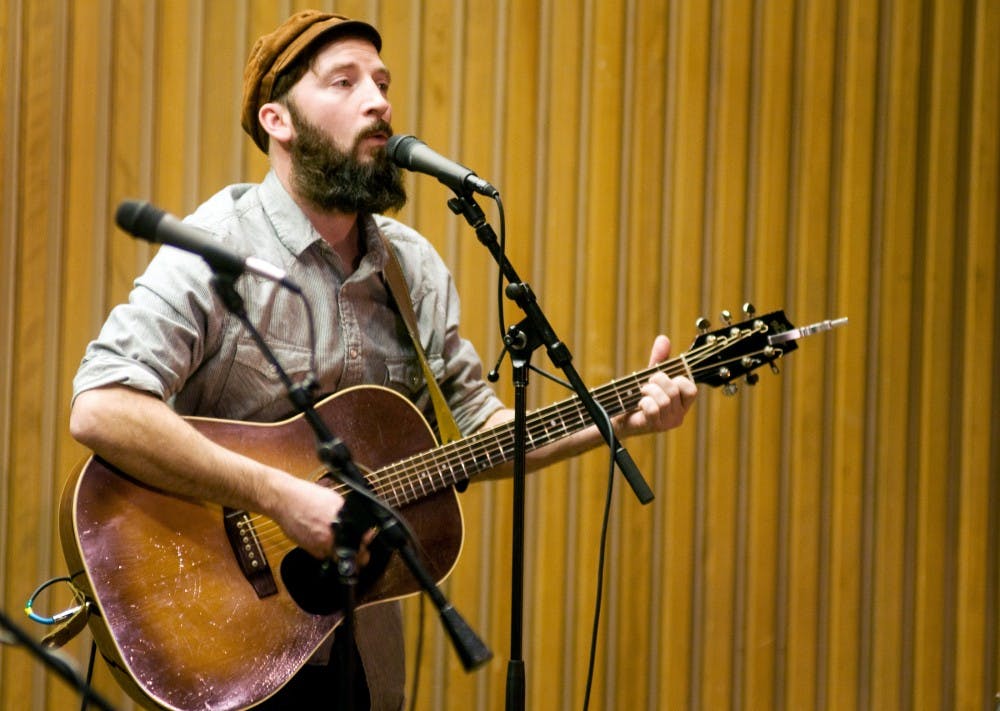 	<p>Guitarist Jay Gavan of The Red Sea Pedestrians plays Friday night in the Erickson Hall Kiva. The concert was sponsored by Ten Pound Fiddle, a folk music organization in East Lansing.</p>