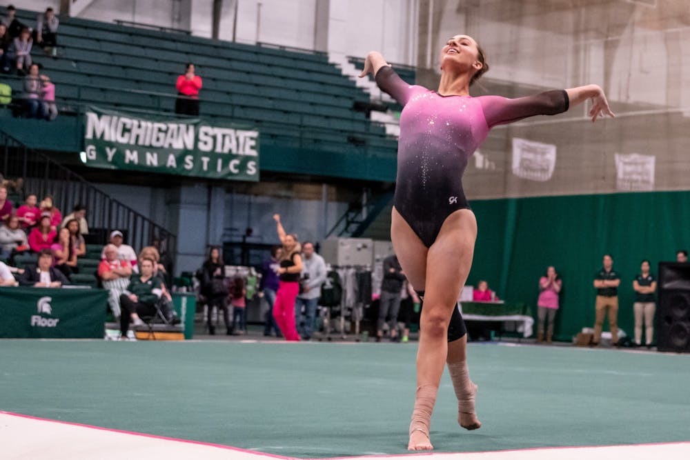 Sophomore Sydney Ewing performs her floor routine during the meet against Minnesota Jan. 18, 2020 at Jenison Fieldhouse. The Spartans defeated the Buckeyes, 195.450-195.325.