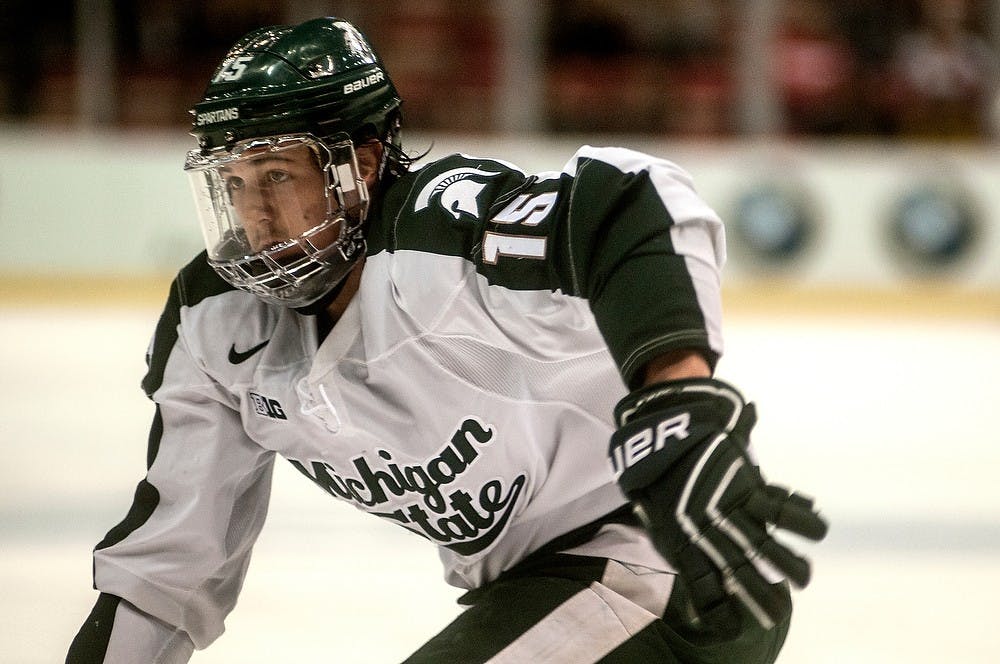 <p>Sophomore forward Mackenzie MacEachern skates toward the puck March 20, 2015, during the Big 10 Hockey Tournament at Joe Louis Arena. The Spartans lost to the Wolverines, 4-1. Allyson Telgenhof/The State News.</p>