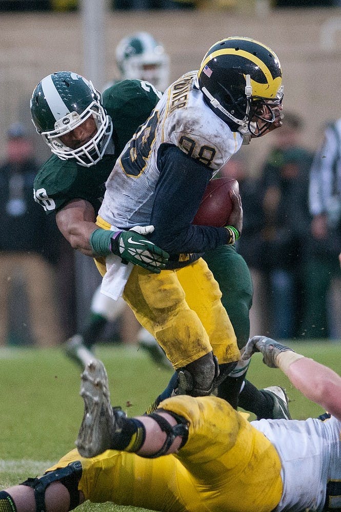 	<p>Senior linebacker Denicos Allen tackles Michigan quarterback Devin Gardner during the game Nov. 2, 2013, at Spartan Stadium. <span class="caps">MSU</span> defeated Michigan, 29-6. Danyelle Morrow/The State News</p>