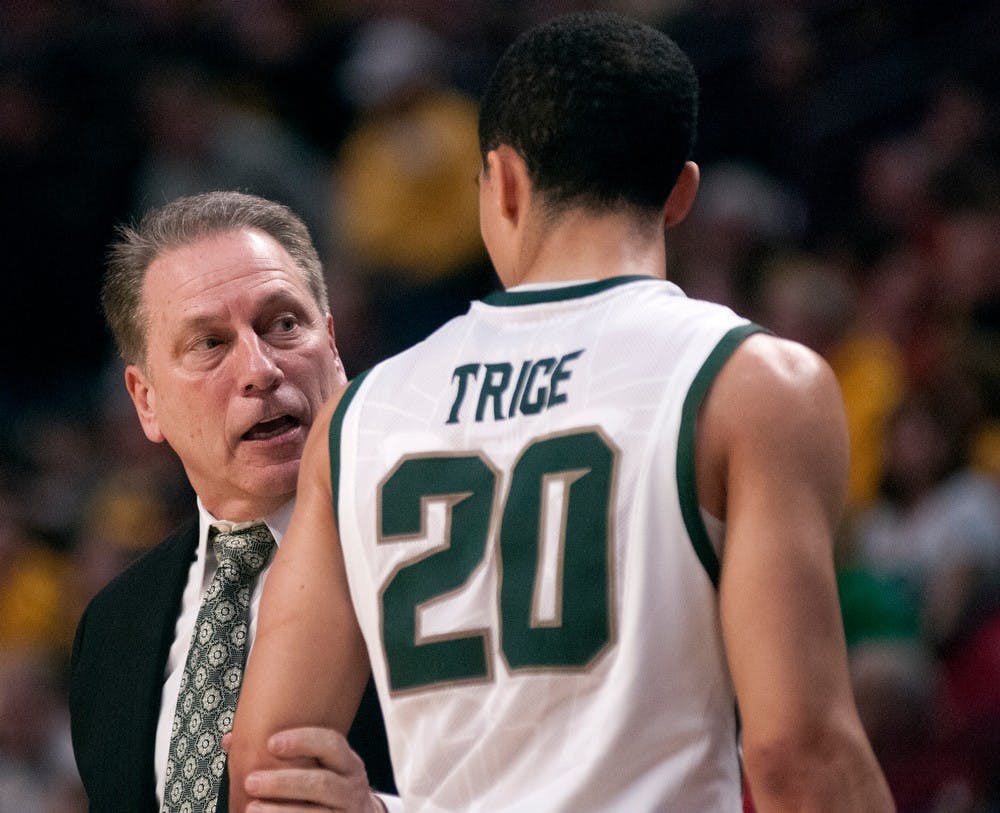 	<p>Men&#8217;s basketball head coach Tom Izzo talks to sophomore guard Travis trice during the second round of the Big Ten Tournament against Iowa on March 15, 2013, at United Center in Chicago, Ill. The Spartans beat the Hawkeyes 59-56. Natalie Kolb/The State News</p>