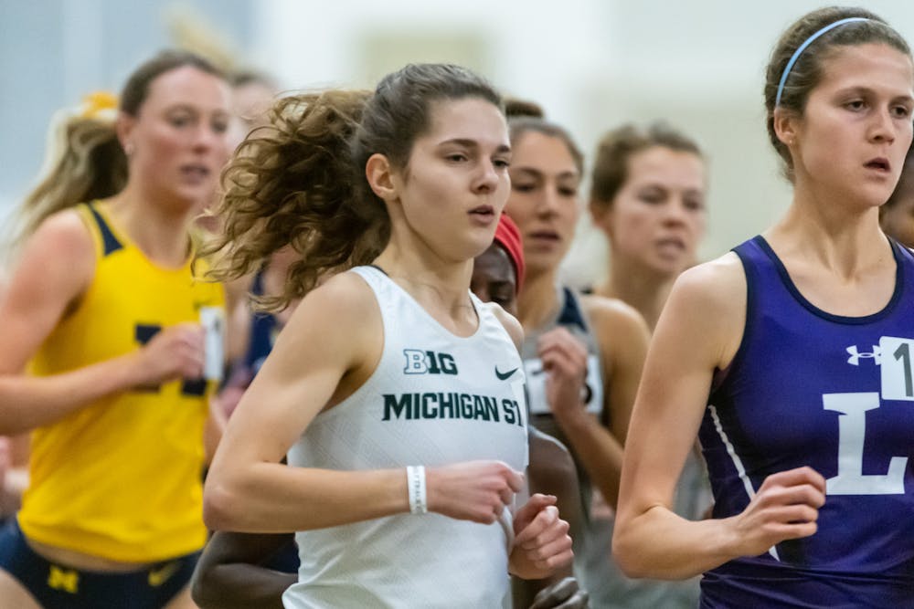 Michigan State track athlete Jenna Magness competes at the University of Michigan's indoor track during one of her events.