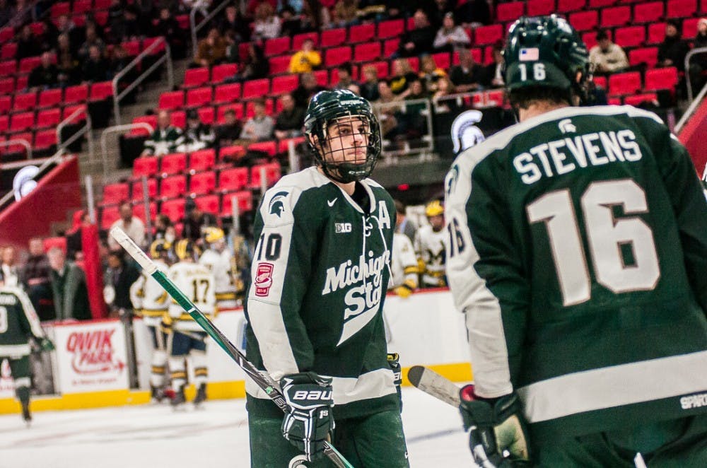 Sophomore forward Sam Saliba (10) looks at teammate freshman forward Brody Stevens (16) during the game against Michigan on Jan. 2, 2018, at Little Caesars Arena.  The Spartans were defeated 6-4 by the Wolverines.  