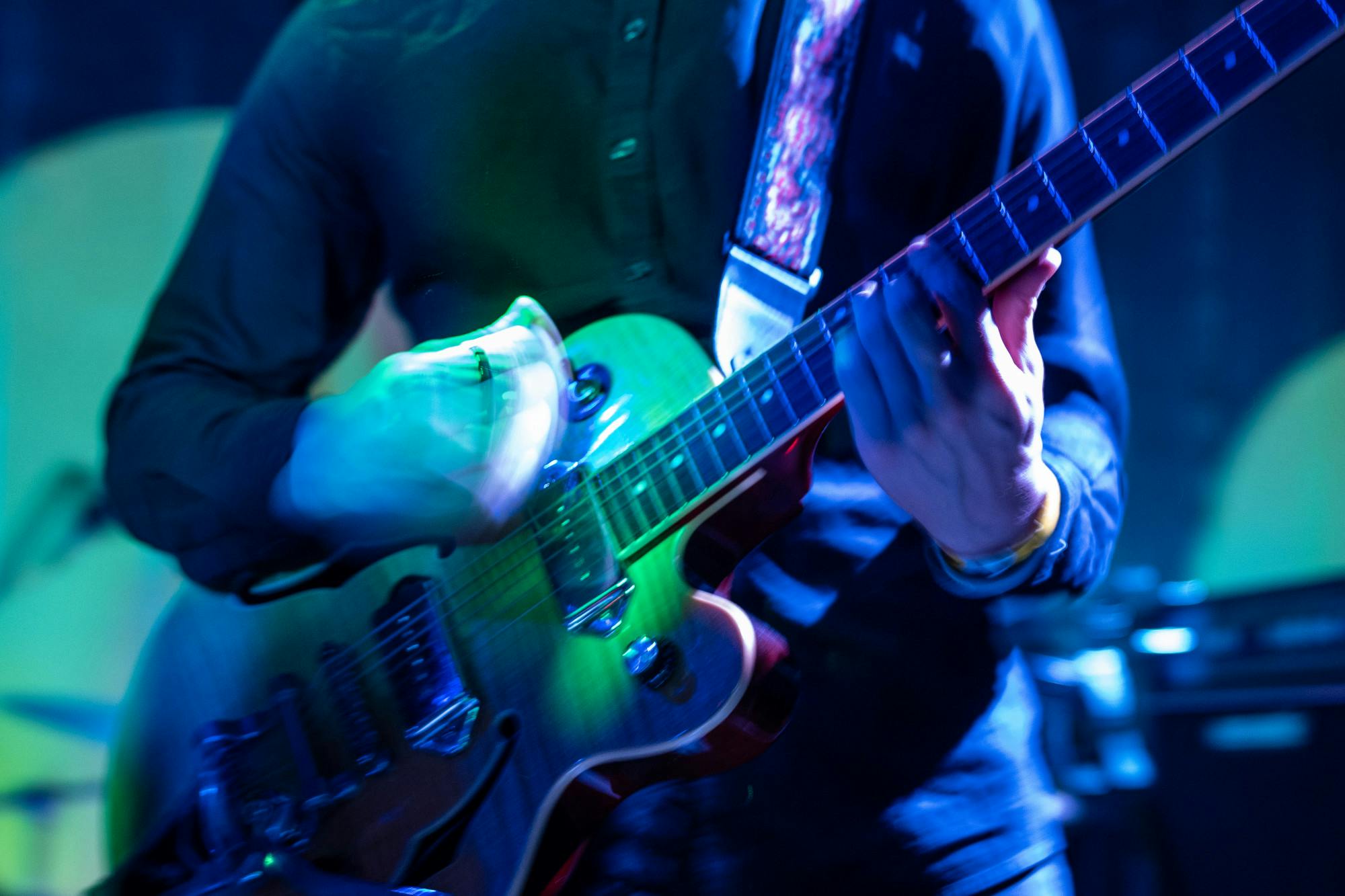 Mitchell Whitaker strums his guitar as Cousin Simple performs at Rick's American Cafe in East Lansing, Michigan on Sept. 14, 2022. The concert was hosted by VIM Magazine as a kick-off to the fall semester.