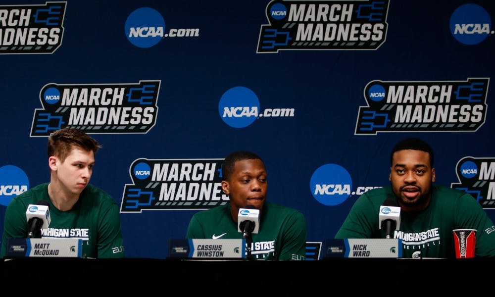 From left to right, senior guard Matt McQuaid (20), junior guard Cassius Winston (20) and junior forward Nick Ward (44) respond to questions during a press conference at Wells Fargo Arena March 22, 2019.during a press conference at Wells Fargo Arena March 22, 2019.