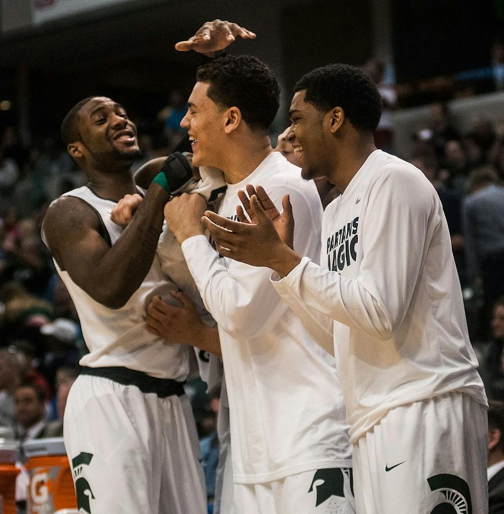 <p>Junior forward Branden Dawson, freshman forward Gavin Schilling, freshman guard Alvin Ellis III all laugh together after a teammate misses a shot March 14, 2014, during a game against Northwestern at the Big 10 tournament in Indianapolis. The Spartans defeated the Wildcats, 67-51. Erin Hampton/The State News</p>