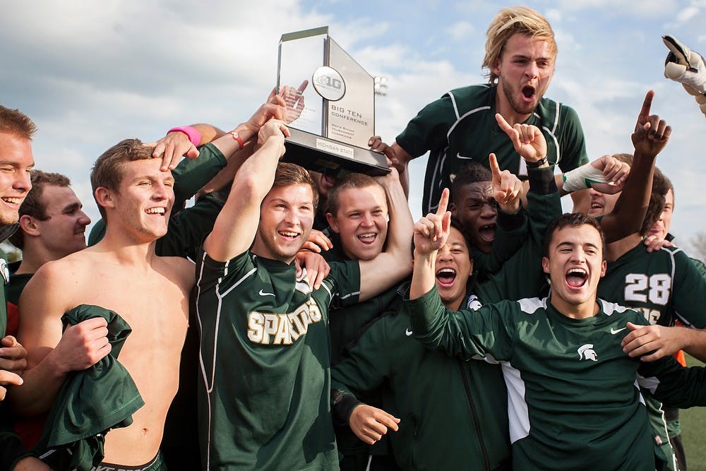 Men's soccer players celebrates their win in the Big Ten Tournament Championship game Sunday, Nov. 11, 2012, at Lakeside Field at Northwestern in Evanston, Ill. The Spartans beat the Wolverines, 2-1, in overtime. Julia Nagy/The State News  