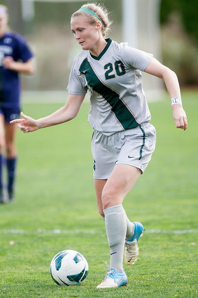 Senior forward Olivia Stander moves up the field with the ball Oct. 27, 2012, at DeMartin Stadium. The Wildcats beat the Spartans 1-0. Natalie Kolb/The State News.