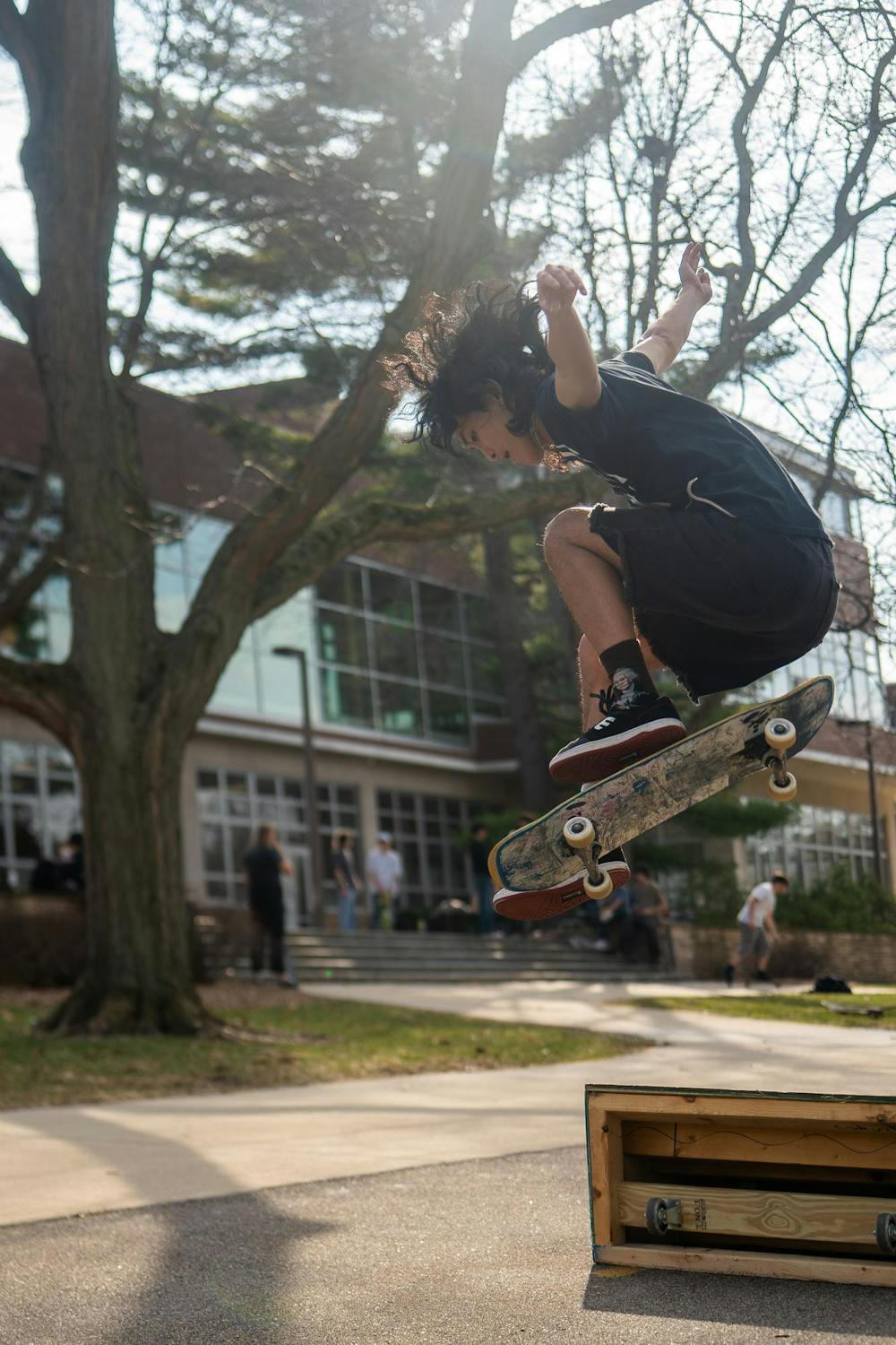 Zachary Stebbins practices skate tricks during MSU Skate Club outside of Shaw Hall on Michigan State University’s campus in East Lansing, Mich., on March 20, 2026.