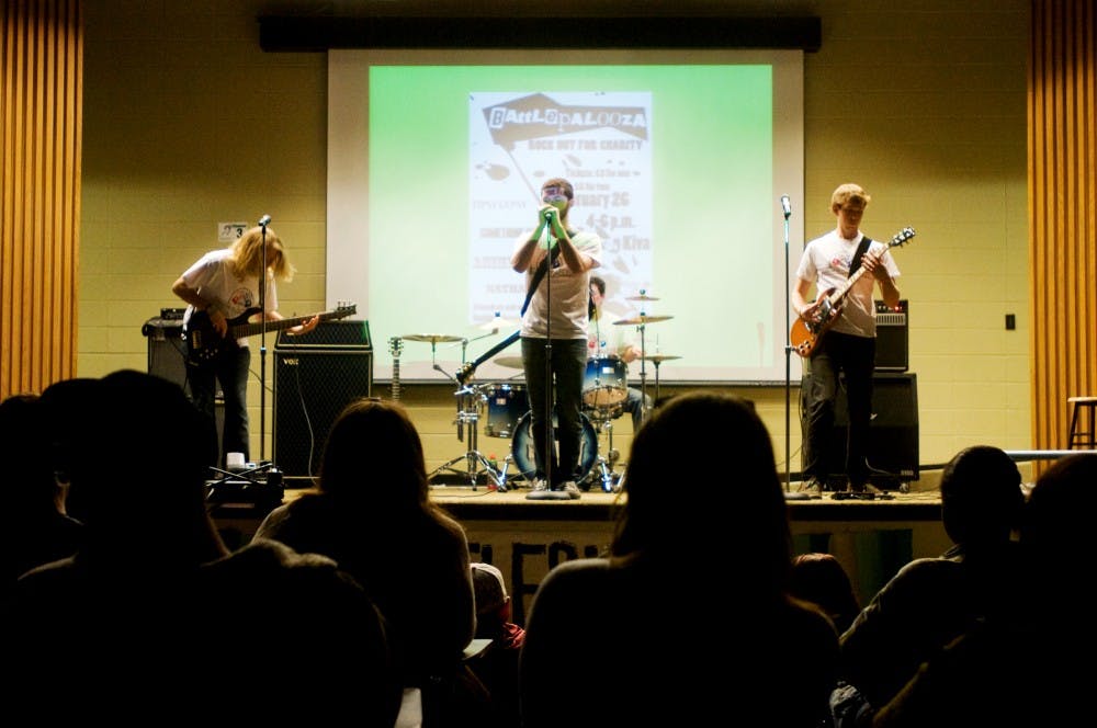 	<p>Something Utopic performs Sunday afternoon at the Erickson Hall Kiva while its fans move closer to listen. Something Utopic was participating in Alpha Phi Omega&#8217;s Battlepalooza which gave the band the opportunity to raise money for its selected charity, the Believe in Miracles Foundation. Anthony Thibodeau/The State News</p>