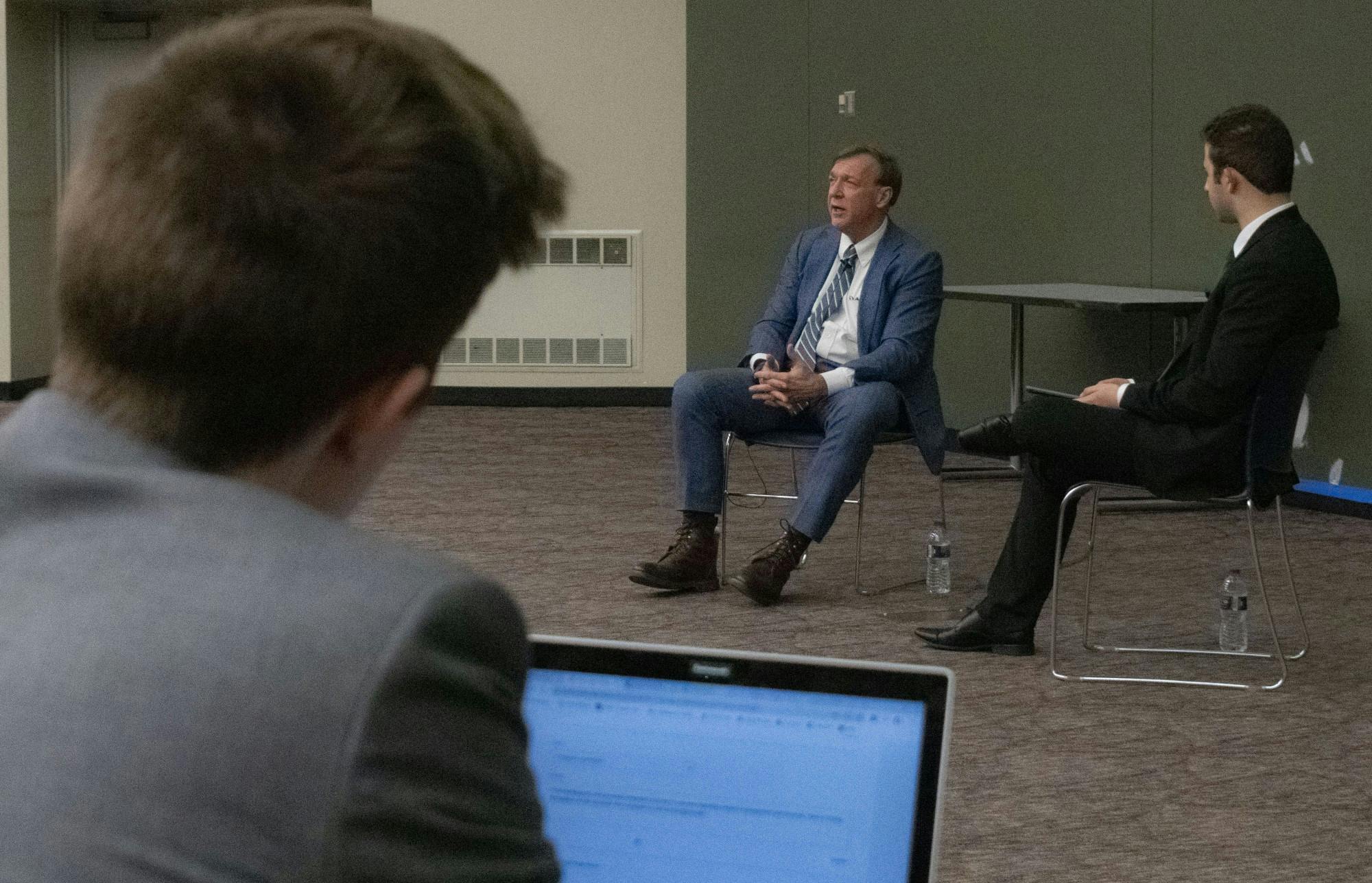 <p>A student watches President Stanley intently as he answers his question about new intramural facilities in the future. Students gathered to ask President Stanley questions about university related topics during the Ask Stanley Q&amp;A hosted in the Business College Complex on Feb. 18, 2020.</p>