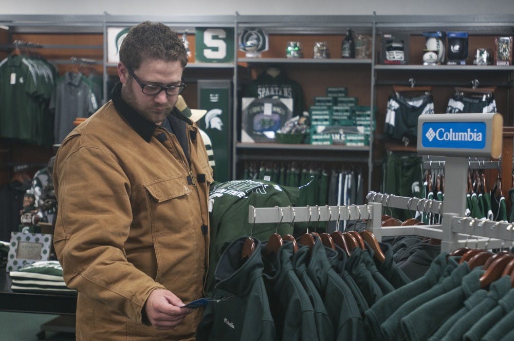 Turf grass management-golf freshmen Michael Vanden Bosch shops for MSU apparel on Oct. 26, 2016 at Campus Street Sportswear. Vandal Bosch said he wasn't sure if he was going to the game but that he would go "tailgating for sure"
