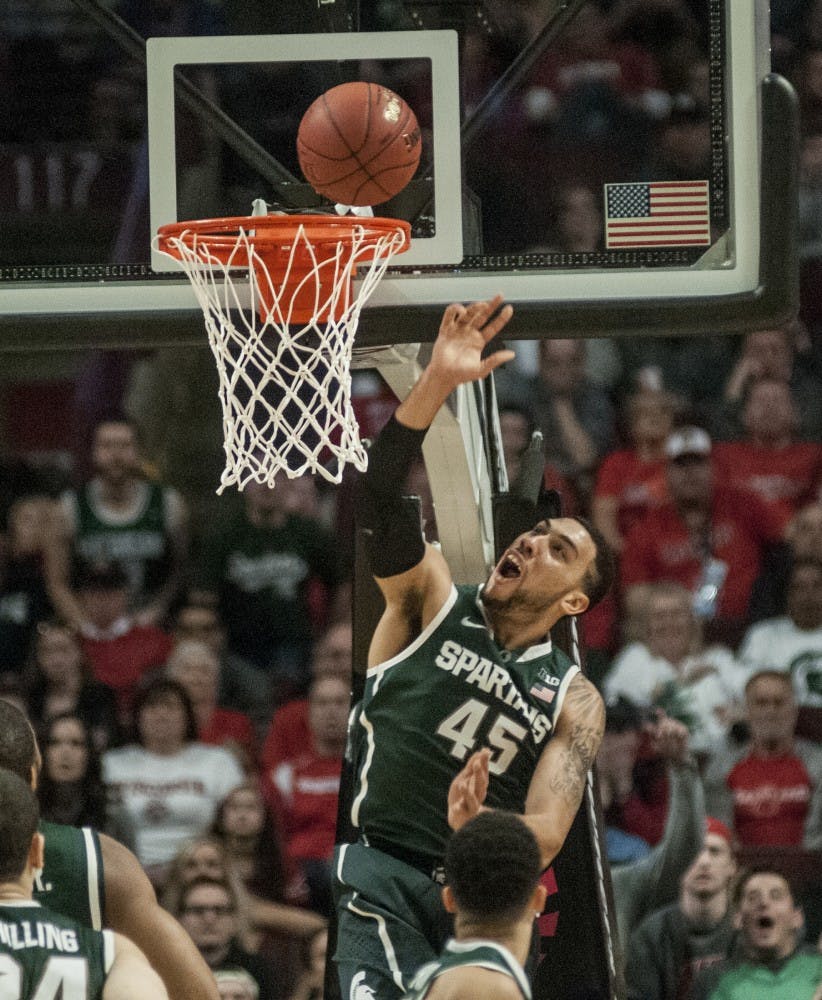 <p>Junior guard Denzel Valentine goes up for a shot Mar. 15, 2015, during the championship game of the Big Ten Tournament against Wisconsin at United Center in Chicago. The Badgers defeated the Spartans in overtime, 69-80. Kelsey Feldpausch/The State News</p>