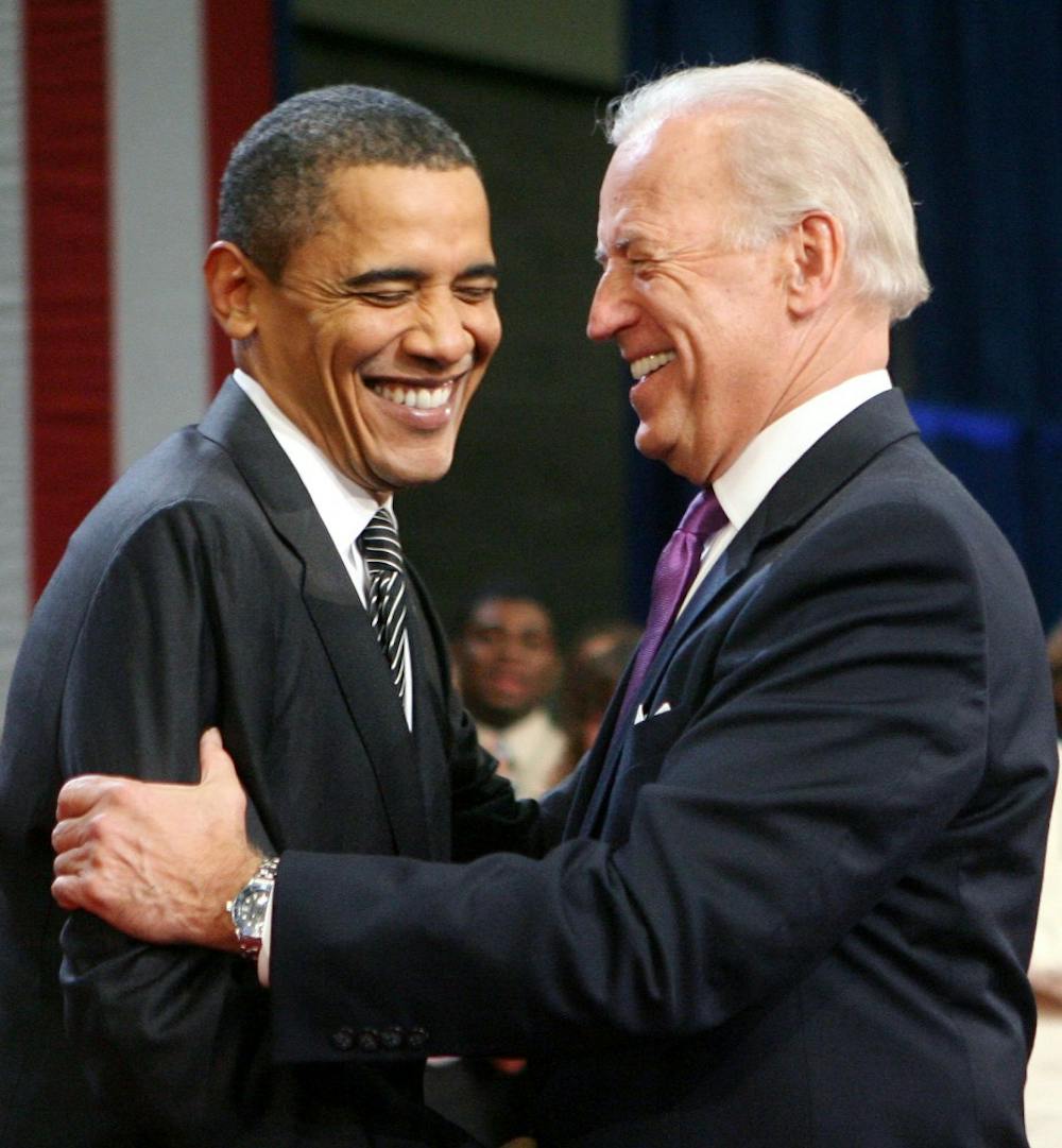 President Barack Obama is welcomed to the stage by Vice President Joe Biden during a Q&amp;A session at a town hall meeting at the University of Tampa in Florida, Thursday, January 28, 2010.  (Joe Burbank/Orlando Sentinel/MCT)