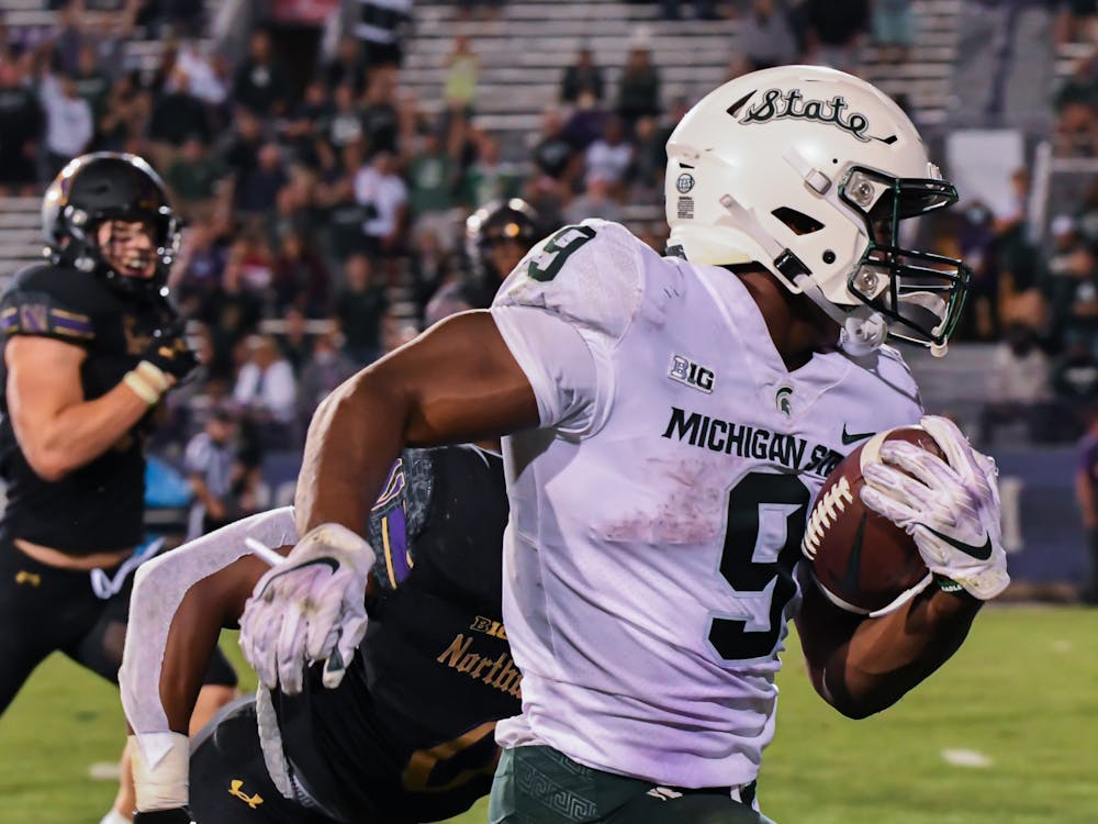 <p>Junior running back Kenneth Walker III gets loose during the Spartans game against Northwestern. Michigan State won the season opener at Ryan Field 38-21, on Sept. 3, 2021.</p>