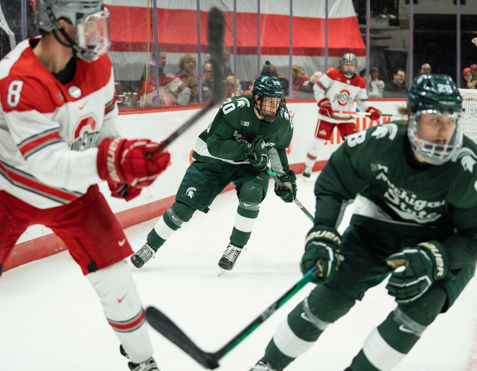 <p>Freshman forward Daniel Russel (20) passes to his teammate during a game against Ohio State University at Schottenstein Center on Jan. 6, 2023. The Spartans lost to the Buckeyes with a score of 3-1. </p>