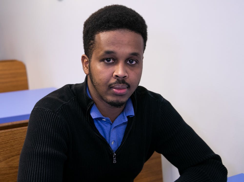 Lansing resident Farhan Sheikh-Omar poses for a portrait in Lansing March 13, 2020. Sheikh-Omar has been a vocal advocate of his friend Uwimana Gasito in his struggle with ELPD in an incident of excessive police force.