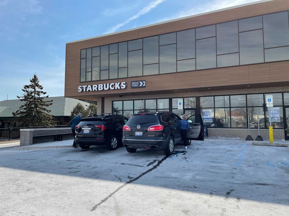 <p>Customers get into their vehicles after visiting the Lake Lansing Starbucks store. The Lake Lansing location filed for a union election in February, the first in greater-Lansing to follow a nationwide trend.</p>