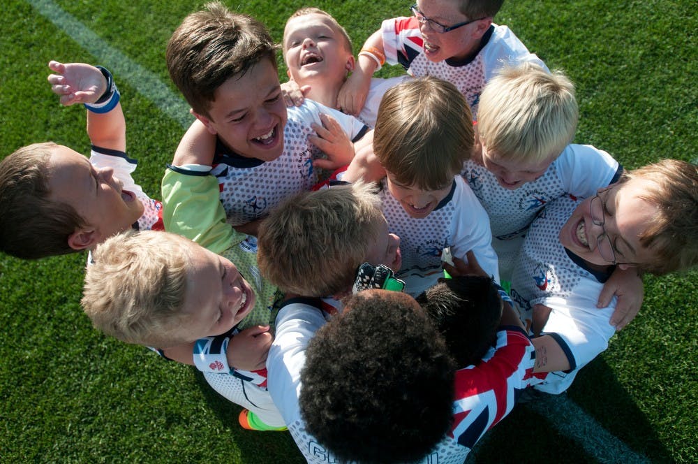 	<p>Great Britain soccer team celebrates after beating the <span class="caps">USA</span> August 8, 2013, during the World Dwarf Games at DeMartin Soccer Stadium. The team won 3-2. Weston Brooks/The State News</p>