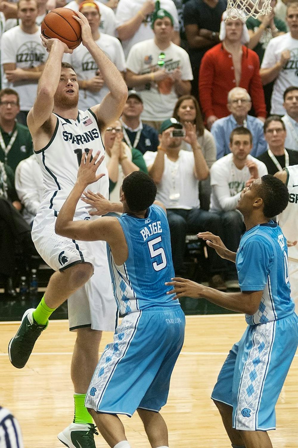 	<p>Sophomore forward Matt Costello jumps up with a rebound during the game against North Carolina on Dec. 4, 2013, at Breslin Center.The Spartans are tied with the Tar Heels at the half, 32-32. Danyelle Morrow/The State News</p>