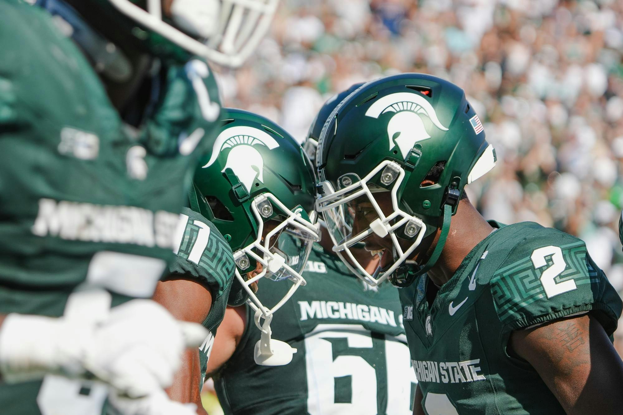 <p>MSU sophomore quarterback Aidan Chiles (2) celebrates a touchdown with redshirted freshman receiver Aziah Johnson (11) at Spartan Stadium on Sept. 14, 2024.</p>