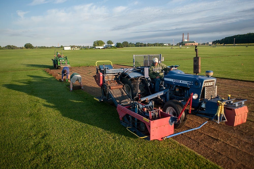 	<p>Laborer Randy Strouse operates a sod-cutting machine as the team harvests the turf June 18, 2013, near the Hancock Turfgrass Research Center, 4444 Farm Lane. The center supplies turfgrass to athletic fields on campus, as well as supporting the turfgrass research of the Department of Crop and Soil Sciences. Justin Wan/The State News</p>