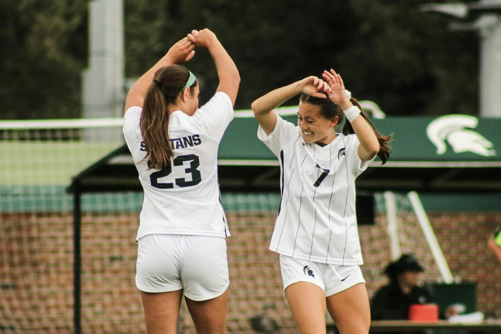 <p>Freshman forward/midfielder and senior forward/midfielder Bella Najera (23) and Gabby Mueller (7) hip bump during pre-game at DeMartin Soccer Complex on Sept. 17, 2023.</p>