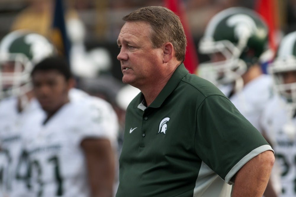 <p>Linebackers/Special Teams coach Mark Snyder watches the team during warm-ups on Sept. 4, 2015, before a game against Western Michigan at Waldo Stadium in Kalamazoo, Mich. The Spartans beat the Broncos, 37-24. Julia Nagy/The State News</p>