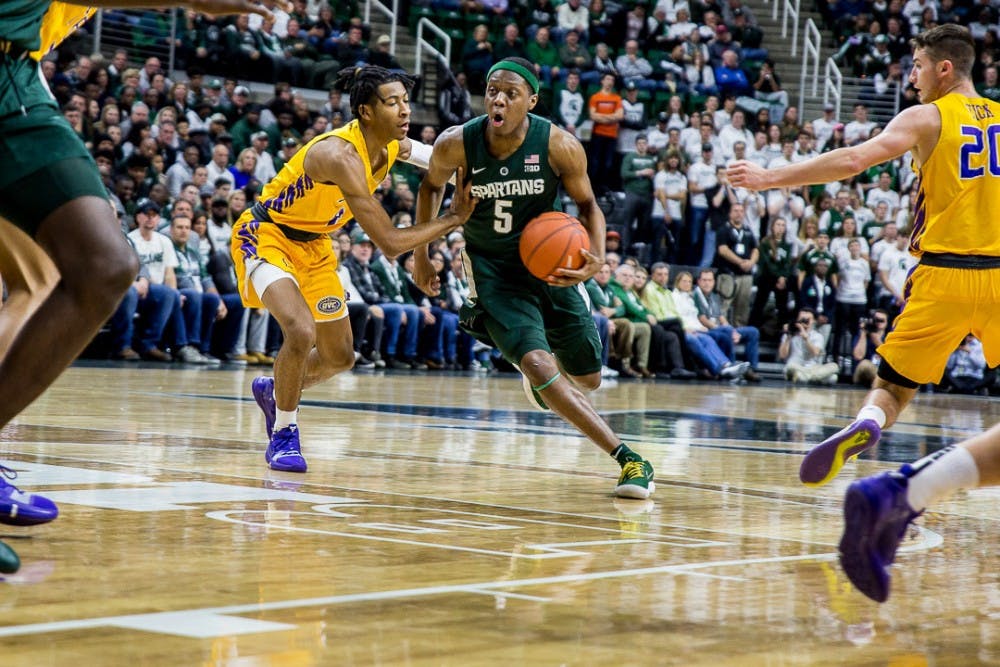 Junior guard Cassius Winston (5) drives the ball towards the net during the game against Tenessee Tech on Nov. 18, 2018 at the Breslin Center. The Spartans were ahead, 42-14 at halftime.