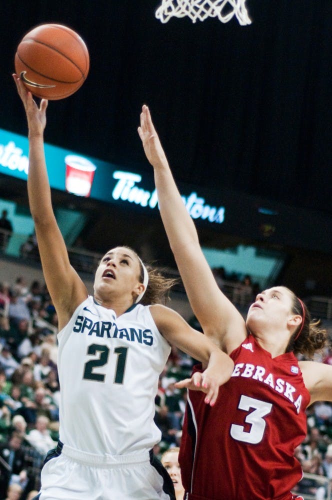 Sophomore guard Klarissa Bell beats Nebraska forward Hailie Sample to the net and finishes the Spartan offensive drive. The Spartans lead the Cornhuskers 43-22 at the half Thursday evening at Breslin Center. Anthony Thibodeau/The State News