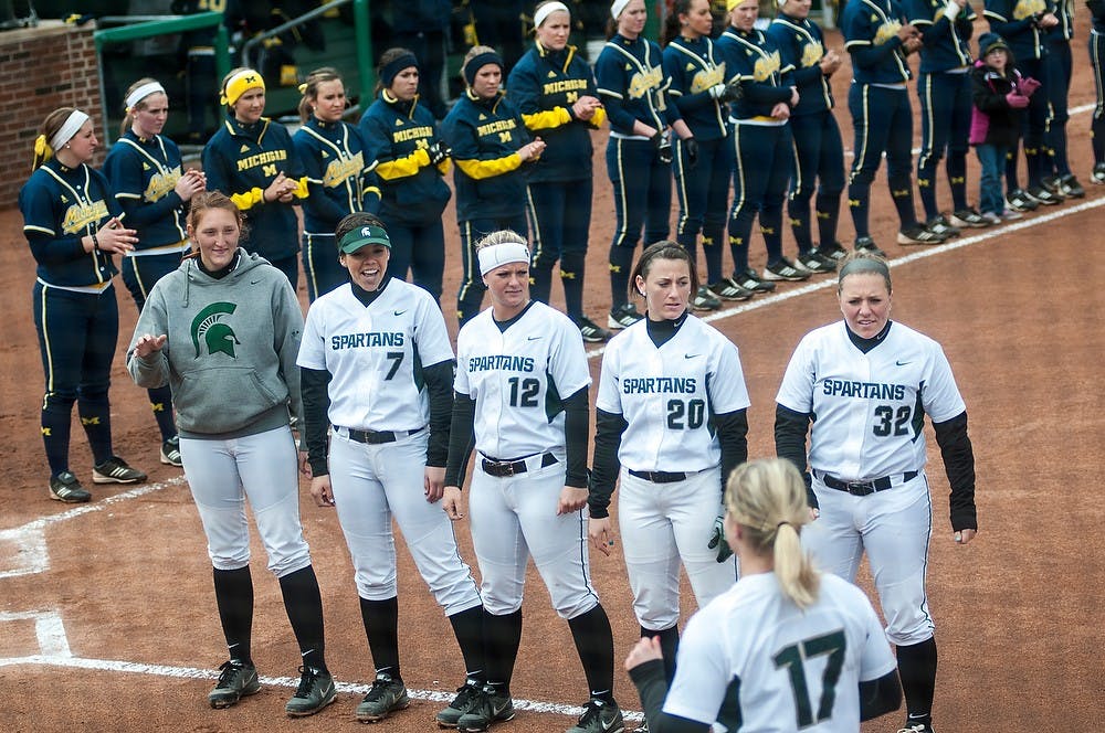 	<p>Starters of the <span class="caps">MSU</span> softball team line up on the first base line before the start of the game against Michigan on Sunday, April 14, 2013, at Secchia Stadium at Old College Field. The start of the game was delayed by an hour due to snow and rain. Katie Stiefel/The State News</p>