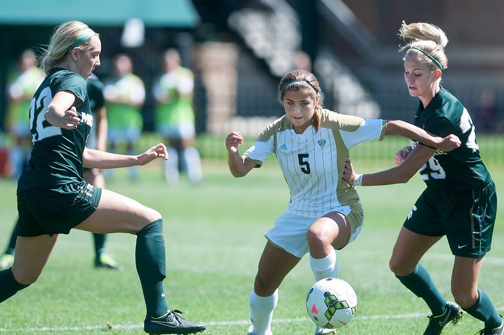 <p>Freshman midfielder Morgan McKerchie attempts to steal the ball from Western midfielder Ariana Donahue on Sunday at DeMartin Stadium at Old College Field during a game against Western Michigan University. The Spartans defeated the Broncos, 3-2 in double overtime. Aerika Williams/The State News.  </p>