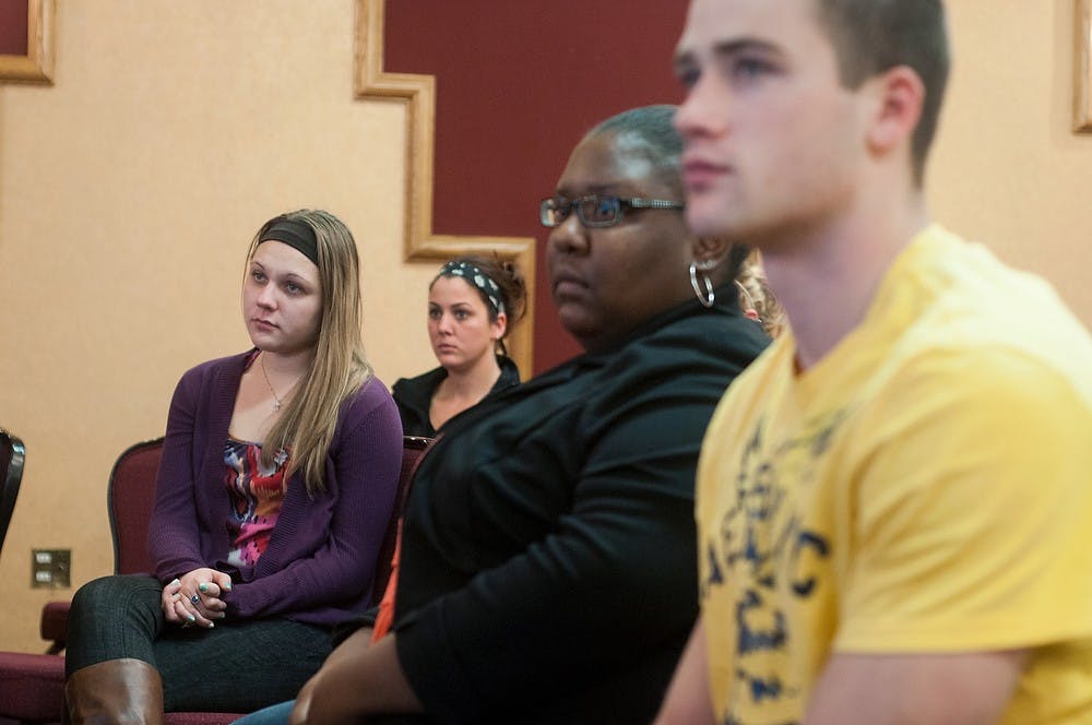 	<p>Communication senior Melissa Klusek, left, listens to a story about organ donation during the Real Heroes event on Wednesday, Nov. 14, 2012, at the <span class="caps">MSU</span> Union. About 20 students attended the event. Julia Nagy/The State News</p>