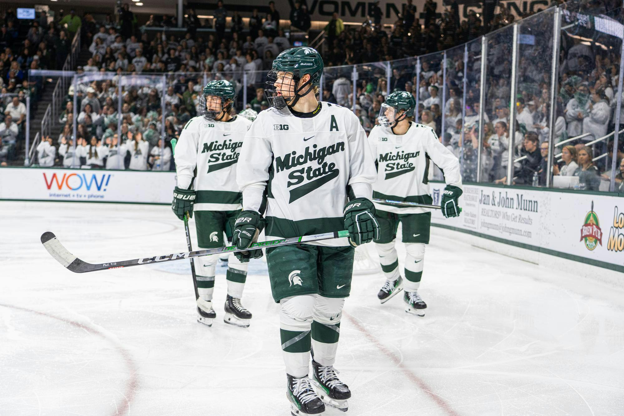<p>MSU alternate captain Matt Basgall and two teammates rest in between plays at Munn Ice Arena on Saturday, Oct. 7, 2023. The Spartans won 5-2. Last year, Basgall recorded two goals and nine assists for the Spartans.</p>