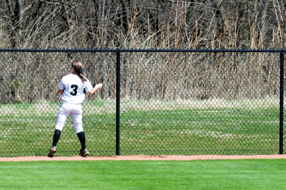 	<p>Sophomore outfielder Kylene Hopkins looks over the fence after Indiana pitcher Morgan Melloh hit a home run Saturday afternoon at Secchia Stadium. The Spartans lost Saturday&#8217;s game to Indiana, 7-2. Matt Hallowell/The State News</p>