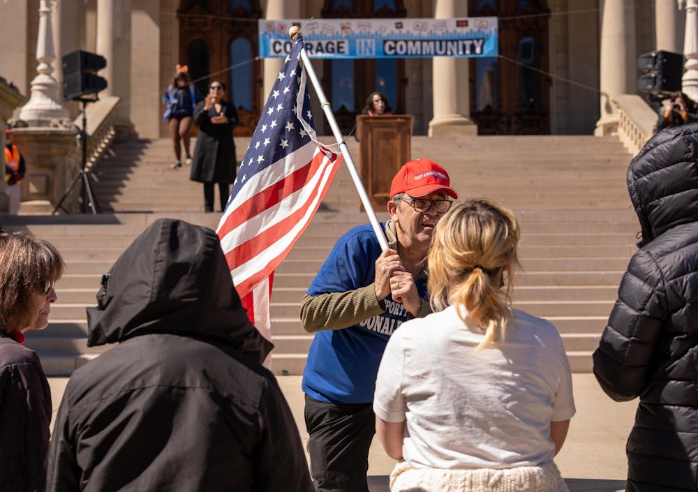 <p>A group of protestors discuss their differing beliefs during the No Kings Protest at the Michigan State Capitol in Lansing, MI on March 28, 2026.</p>
