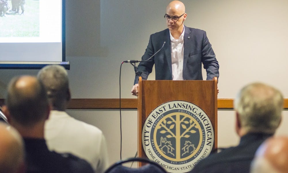 <p>East Lansing City Manager George Lahanas gives a speech during East Lansing's Chief of Police Jeff Murphy's retirement ceremony on May 30, 2017 at East Lansing Hannah Community Center at 819 Abbot Rd. Murphy was honored for his 30 years of service with the East Lansing Police Department.</p>