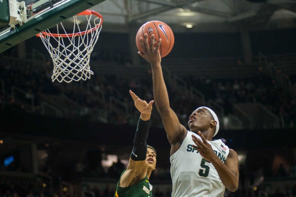 Junior guard Cassius Winston (5) goes for a layup during the game against Northern Michigan at Breslin Center on Oct. 30, 2018. The Spartans defeated the Wildcats, 93-47.