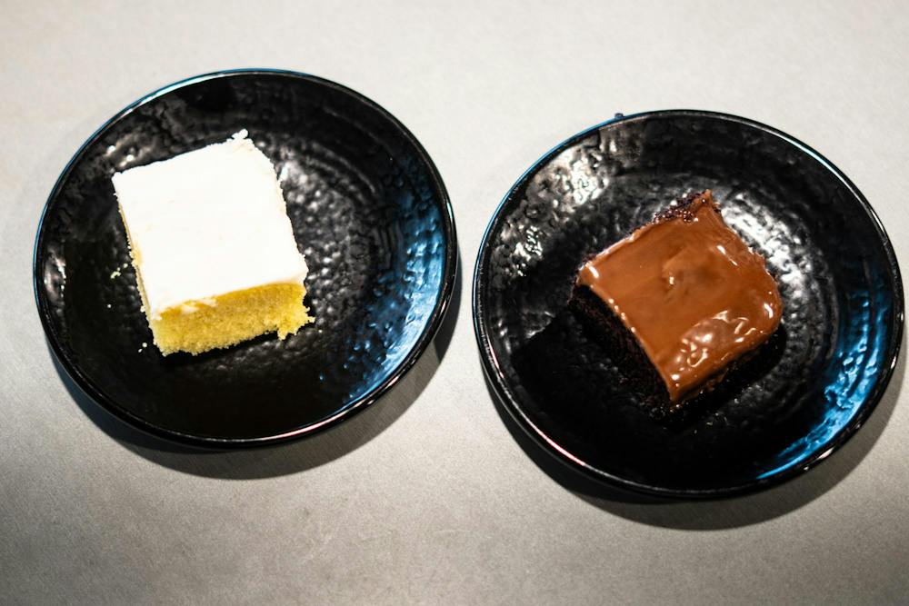<p>Two of the vegan cake options, vanilla (left) and chocolate (right), that are served in Brody Square in East Lansing, Mich., on Sept. 15, 2026.</p>
