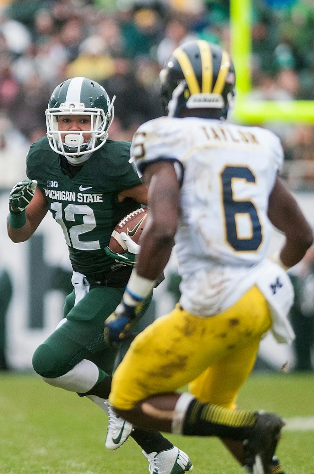 	<p>Freshman wide receiver R.J. Shelton runs the ball during the game against Michigan on Nov. 2, 2013, at Spartan Stadium. The Spartans defeated the Wolverines, 29-6. Khoa Nguyen/The State News</p>