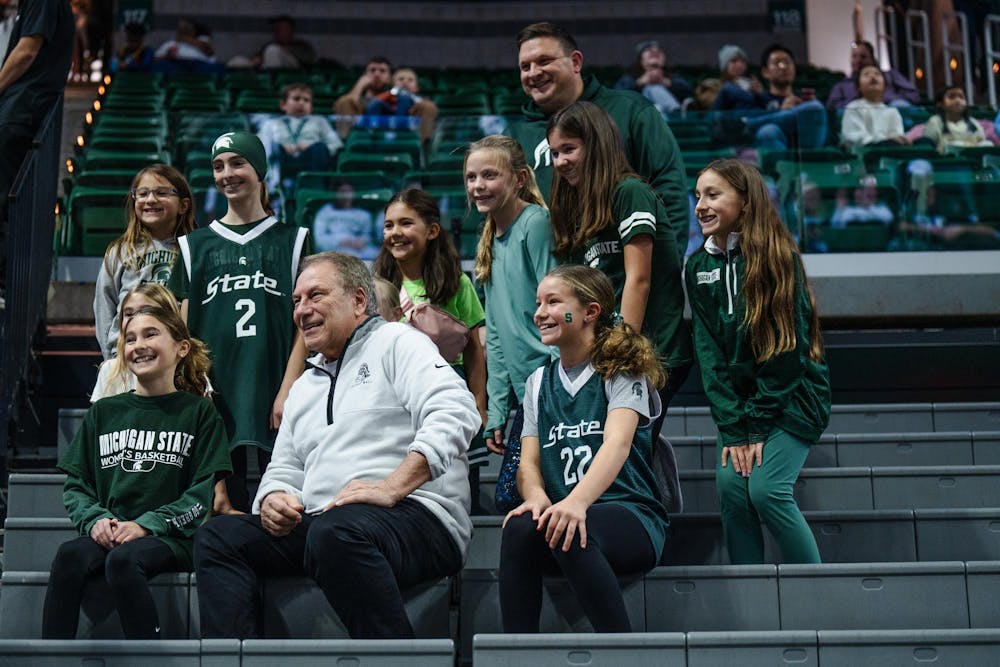 <p>Michigan State men's basketball head coach Tom Izzo poses for a picture with fellow Spartans at the women’s basketball game against DePaul University at the Breslin Center on Dec. 8, 2024. The Spartans won 89-61 against the Blue Demons, starting the season 9-0 for the first time in program history.</p>