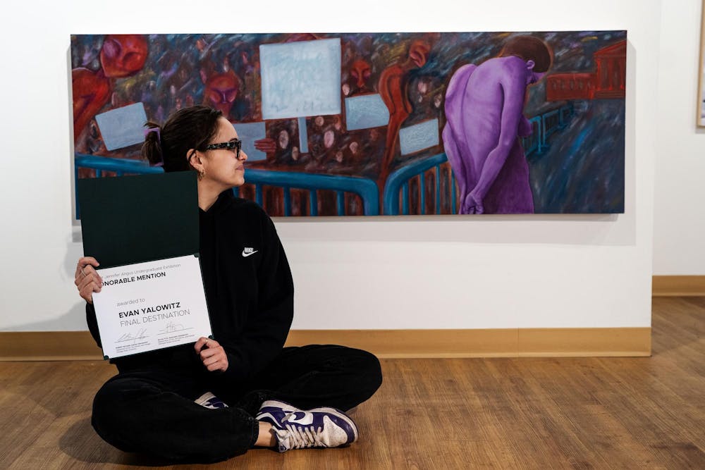 Fourth-year Michigan State studio art student Evan Yalowitz poses in front of her piece, Final Destination, selected for the Scene Metrospace Undergraduate Exhibition on April 13, 2025. The gallery, where two of her works are featured, is open from April 4-24, 2025.