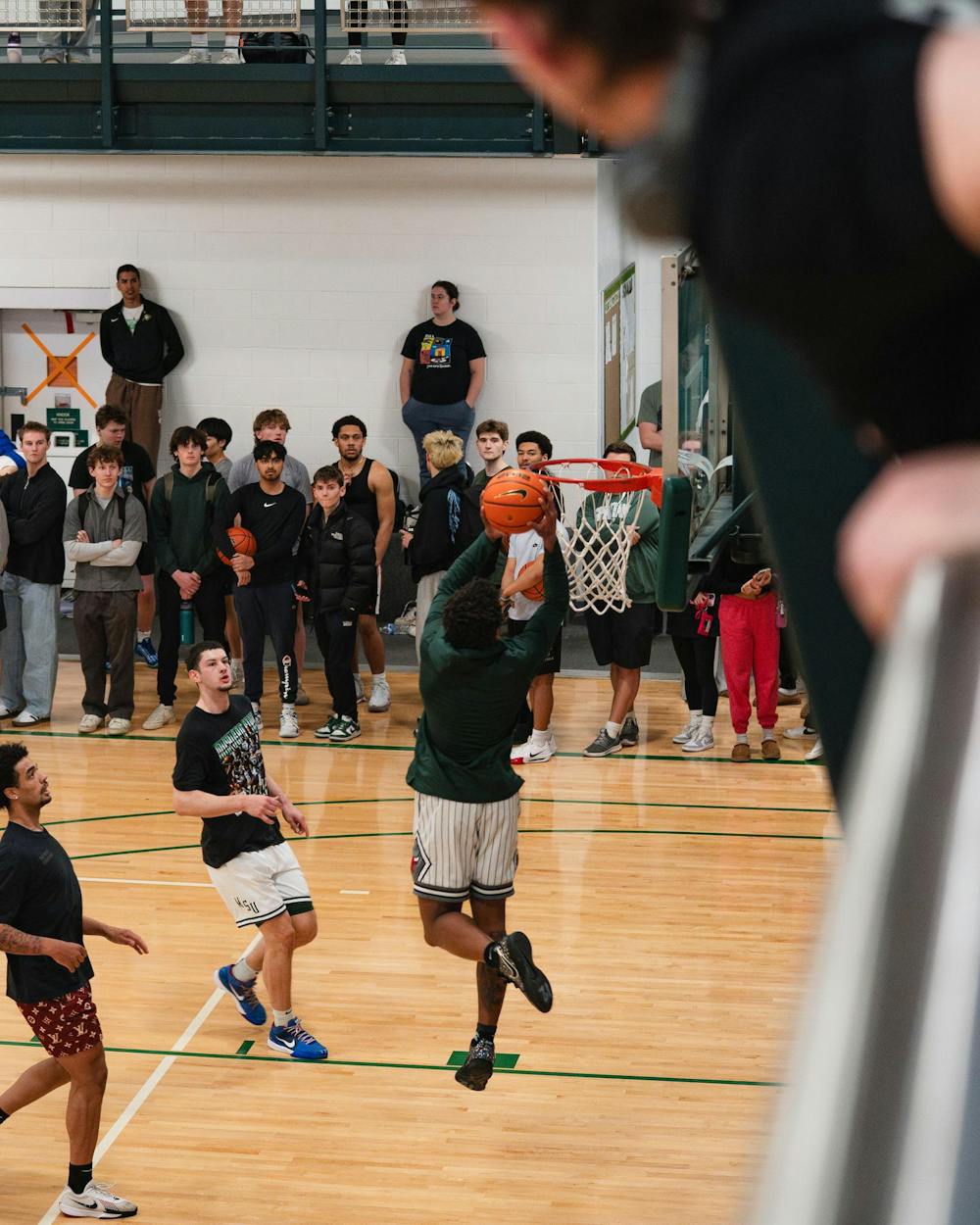 <p>Michigan State sophomore guard Jeremy Fears Jr. dunks the ball at IM East on April 16, 2025. The men's basketball team showed off their skills during pickup runs for students to enjoy.</p>